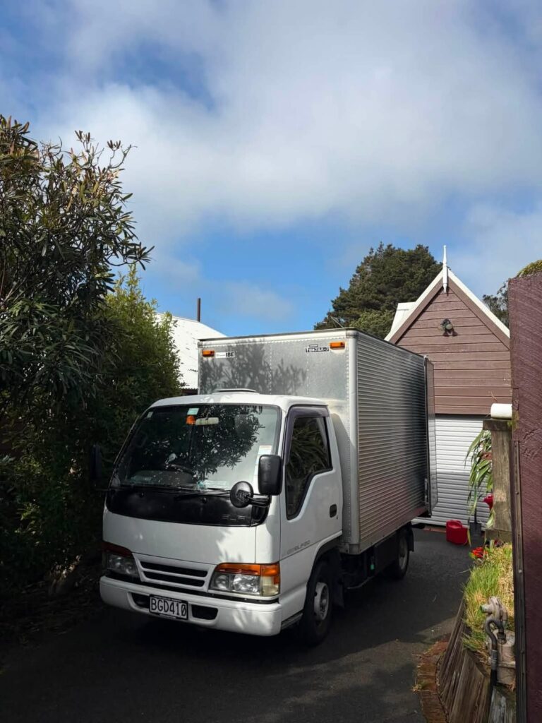 Moving truck backed into a narrow driveway